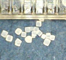 Image taken with a USB microscope of ordinary table salt, sodium chloride. The ruler marks are each one millimeter.