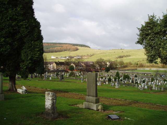 Ballingry cemetery to the East of Benarty Hill - seen in the background on the left of the photograph - Some of the graves go back hundreds of years.