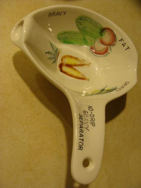 Isn't this cute? It's a no-drip gravy separator. You can use this to separate your pan juices when roasting to make gravy from the juices, too.