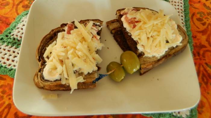 Veggie spread on marbled rye....topped with parm....is a combination that makes your tastebuds happy