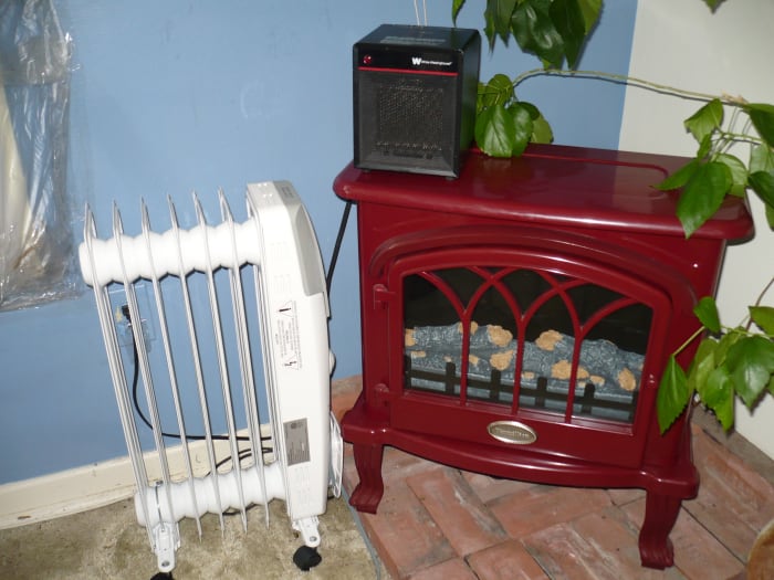 From left to right the heaters are Garrison oil filled Heater, White Westinghouse Fan Heater( is the little black heater on top), and the Vermillion Electric Fireplace Stove/heater.
