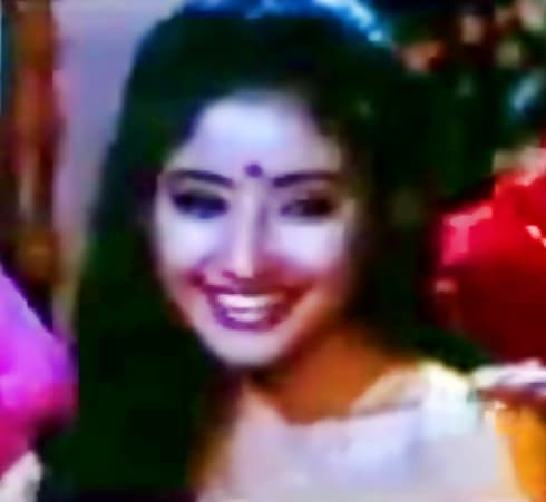 Manisha Koirala in "Banno teri ankhiyan" from Dushmani: a song for the haldi ceremony, part of preparing the bride for marriage.
