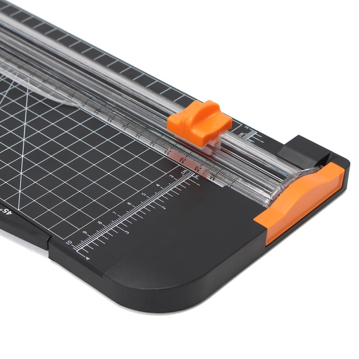 Measure your photo with a ruler. Then decide how big and how many mats that you want for your photo. Use your paper cutter to cut your mats to the exact measurements for your needs.