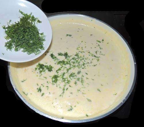 turn off heat, and add dill. Hopefully, your water should be boiling now--an easy boil though, not roiling--and so let's cook the dumplings.
