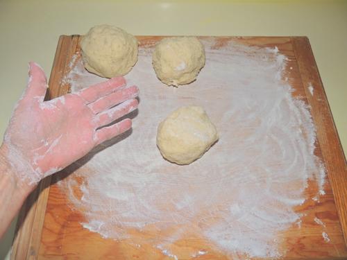 flour hands and work surface. Roll manageable dough balls to be further rolled into a tube of gnocchi