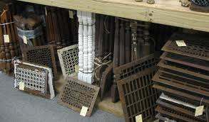 Old iron grates or heavy pieces of industrial type metal, often discarded, make great center pieces for a wall grouping.