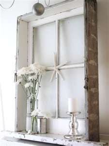 An old window still in the frame creates the perfect shadow box that can be filled with anything you find. It can be as simple as a basket of pine conss