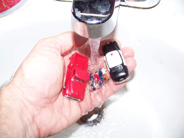 I just rinse small objects such as scale people, cars, and trucks to remove dust/dirt then blot them dry on a paper towel.