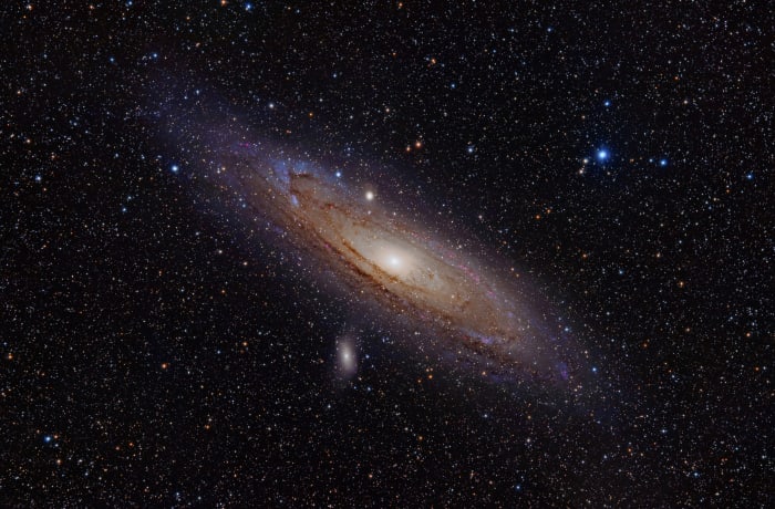 The Andromeda Galaxy is a spiral galaxy approximately 2.5 million light years away in the constellation Andromeda. The image also shows Messier Objects 32 and 110, as well as NGC 206 (a bright star cloud in the Andromeda Galaxy) and the star Nu Andro