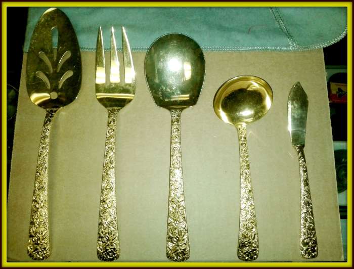 Cellini Romanesque Serving Set: This set includes Serving Fork, Server, Serving Spoon, Soup / Gravy Ladle, Butter Knife; they are stamped N.Y.M. Co., 1968.