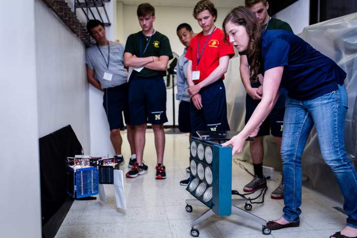 Students learn about the physics of heat on satellites.