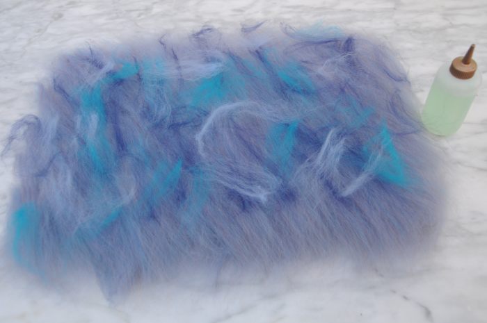 Add a little decoration, use either contrasting wool fibers or silk fibers as shown here