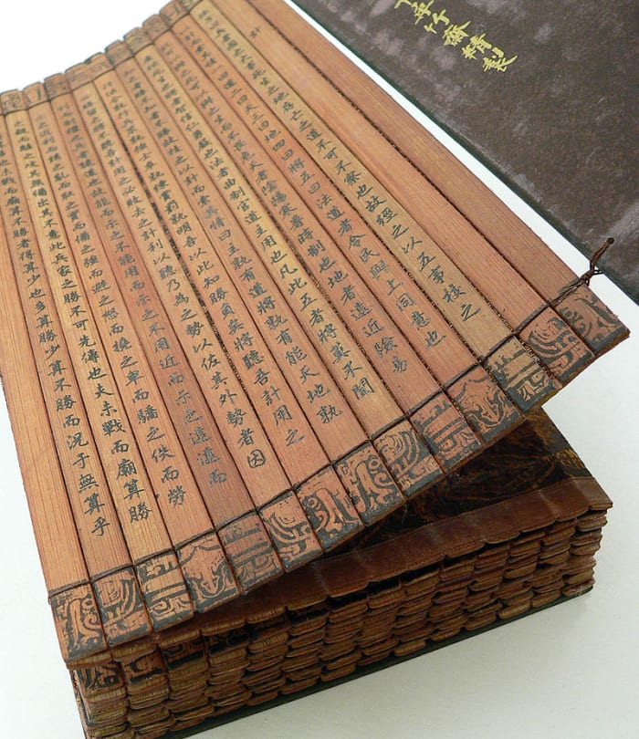 An actual copy of 'The Art of War' as it was originally written on bamboo strips then bound together.