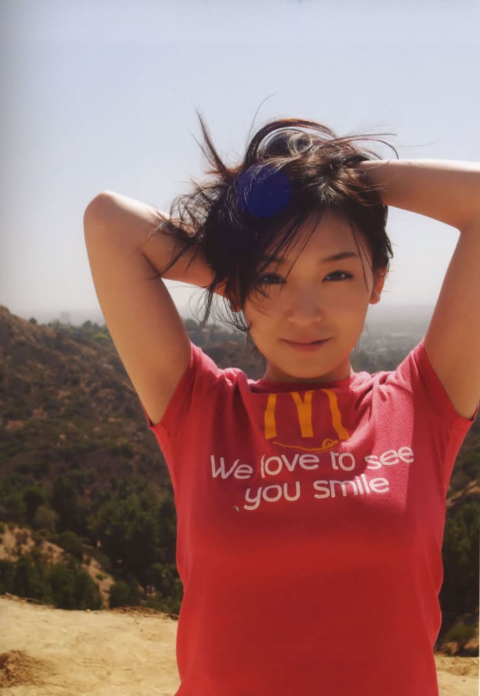 Ai Kago wearing a t-shirt showing the McDonald's famous slogan. Ai Kago looks really cute in this picture!
