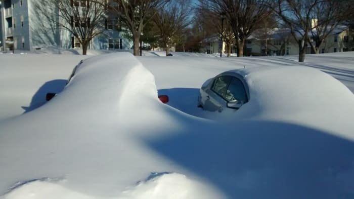 January 23, 2016. After the blizzard, roads and cars in Maryland were buried in the snow.