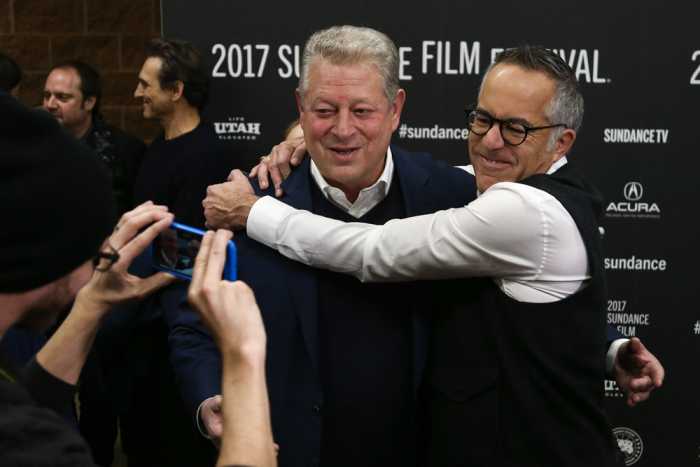 Festival director John Cooper embraced Al Gore at the premiere of the "An Inconvenient Truth" sequel presented at the 2017 Sundance Film Festival.