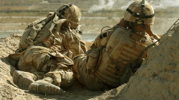 A British sniper and his spotter, like a secondman who verifies a hit. Conditions in Afghanistan demanded accurate spotting, as a miss betrayed the sniper's whereabouts