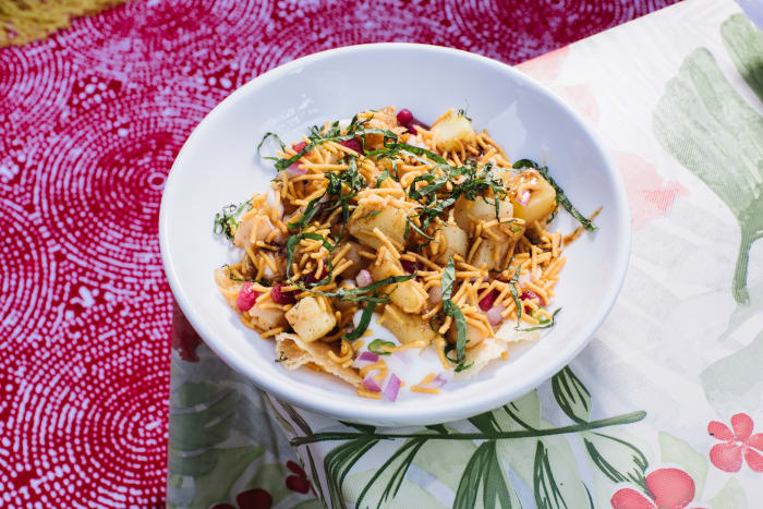 Papri Chaat - Semolina crisps, spiced potatoes, yogurt, onions, chickpeas, mint, tamarind, chaat masala.