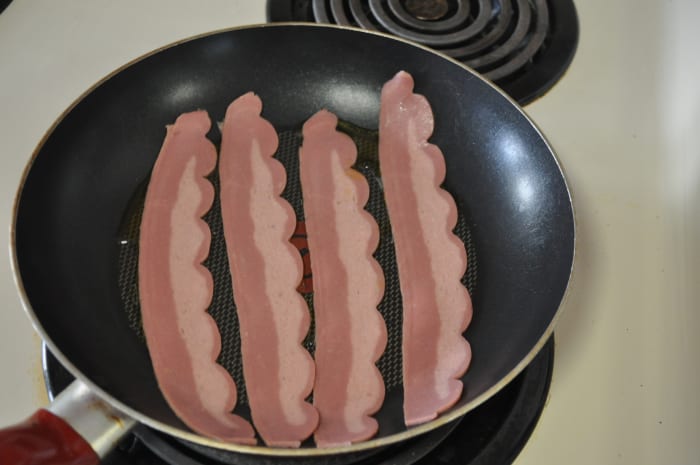Turkey bacon is leaner than pork bacon and will burn fairly easily. Be sure to keep on eye on it to avoid charred flesh.