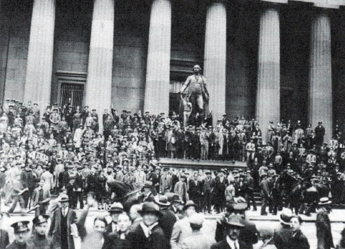 Dazed investors gather outside the New York Stock Exchange following "Black Thursday," October 24. The stock market crash of 1929 was the worst financial upset in U. S. History.