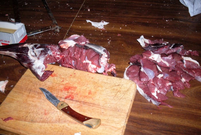 Slice and saw until you are satisfied. You may debone and trim as you go, if you are short on freezer room.