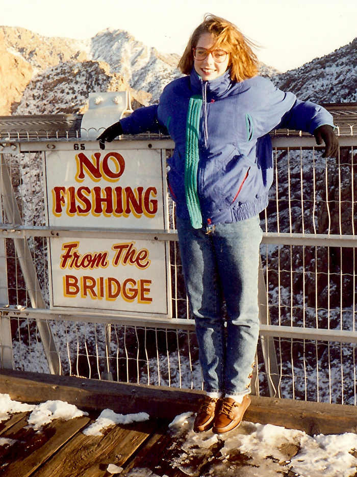 Someone had a sense of humor when posting this sign! Photo of my niece on the Royal Gorge Suspension Bridge.