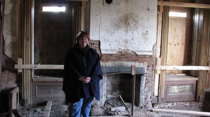 That's me standing in the parlor on the first floor. John Crane opened some of the boards that were covering the windows for us. The inside floors were covered with piegon droppings, so it was interesting walking around in there.