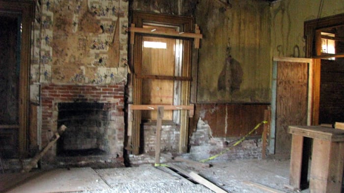 This was supposedly AJ's bedroom on the second floor. Most of the old plaster walls and slats have been torn down. John Crane told us that there was a man living in the house for a while who was attempting to renovate it. He eventually gave up. P