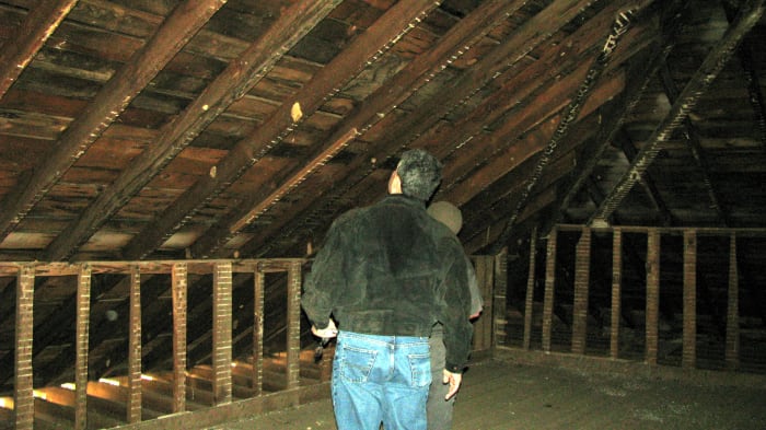 Third photo of John Crane and Jon Almada inspecting the wood used on the roof structure. It is original! Orb in this one is also between the lower upright structures.