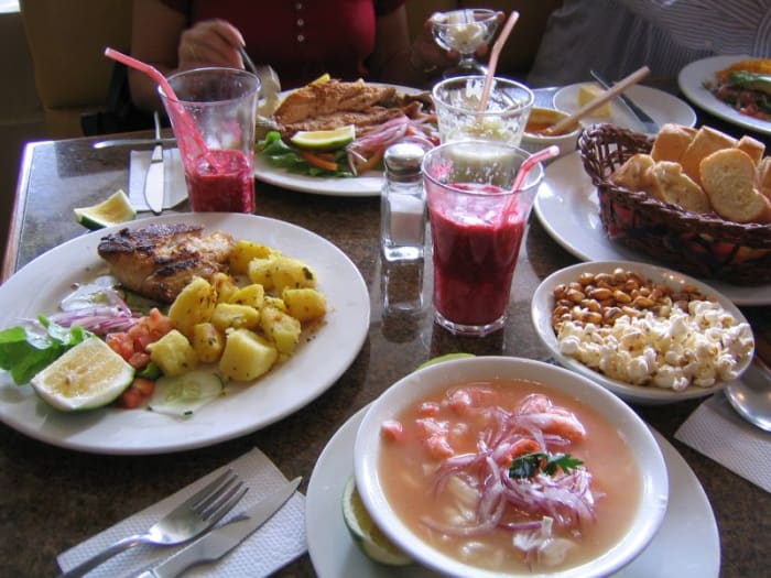 An Ecuadorean meal of soup, plato del dia, with the inevitable popcorn nibbles, and delicious juice!