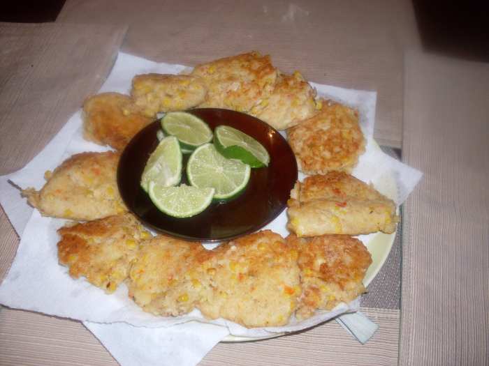 These hot, fresh and delicious homemade tuna fish fritters had canned mexicorn stirred into the fritter batter before the tuna fish fritters were fried in oil in a pan on the stove top.