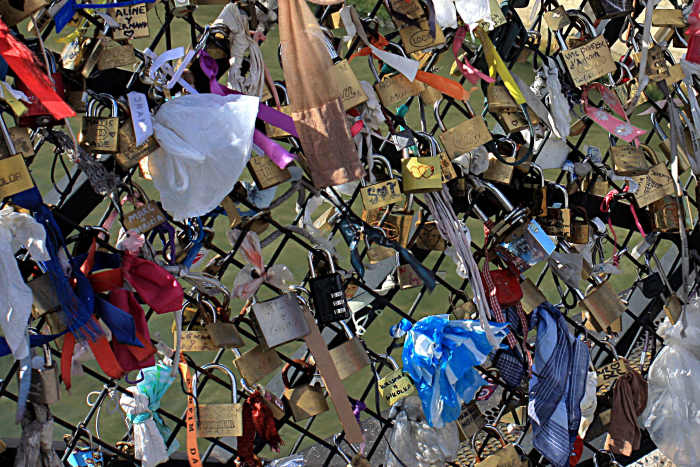 Padlocks and symbols of everlasting love on Le Pont des Arts, as described in the text. This is a pleasing tradition; there isn't room for many more padlocks, but hopefully a way will be found to allow the practice to continue