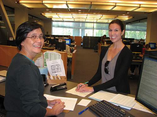 SJSU Librarian Helps Student in Reference - SJSU Librarian Helps Student at Reference Desk, 2nd floor King Library.
