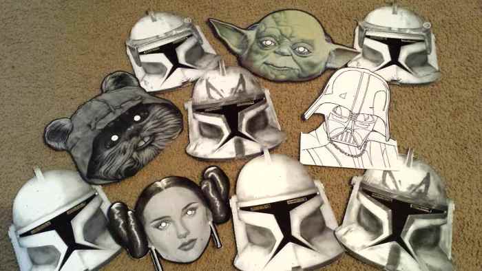 Get familiar with the characters. You can find free Star Wars masks online for your costume or to wear for a photo booth at your Star Wars party. I attached popsicle sticks to these for picture props but you can tie a string around them to wear.