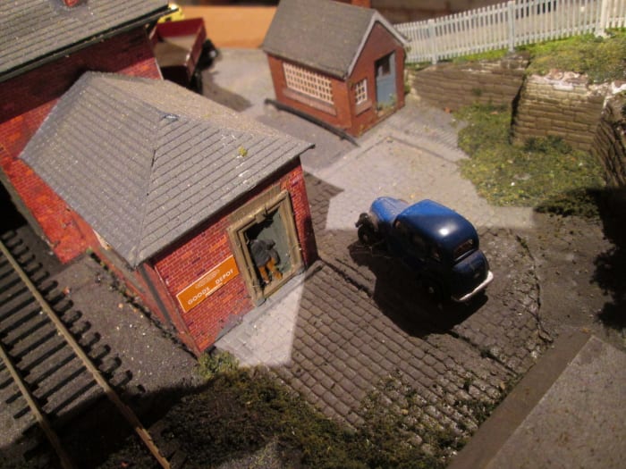The goods office of the depot seen above, complete with Dapol 'customer' in the doorway. Weigh office opposite is an unmodified Arch Laser Co. kit, the weigh deck from Scale Link - the car is Oxford