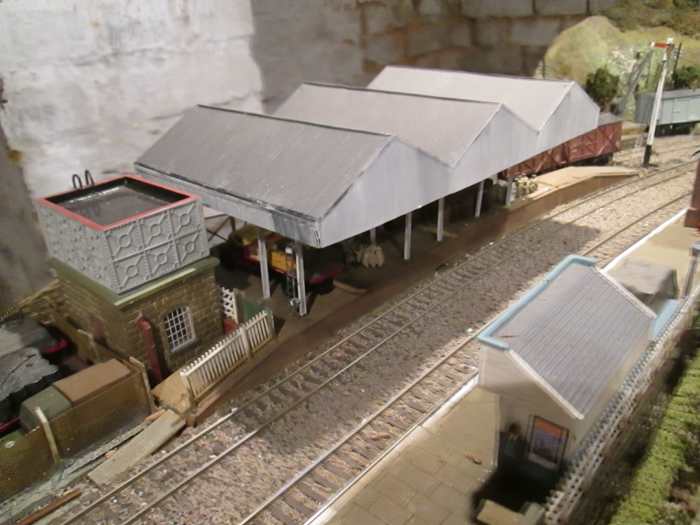 Goods depot roof was bought assembled. Pillars, side awnings and laddering applied to fit the location. The water tower and platform shelter are from Hornby's Skaledale range based on Goathland on the NYMR
