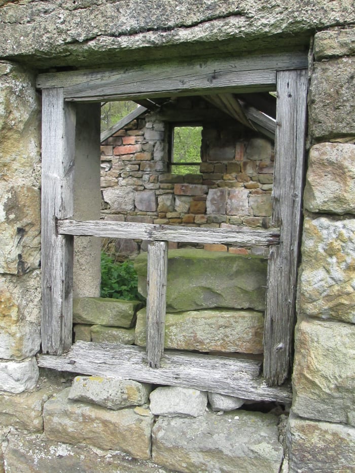It doesn't look as if there was ever anywhere to put feed and the doorway's too narrow or low to lead animals such as ponies