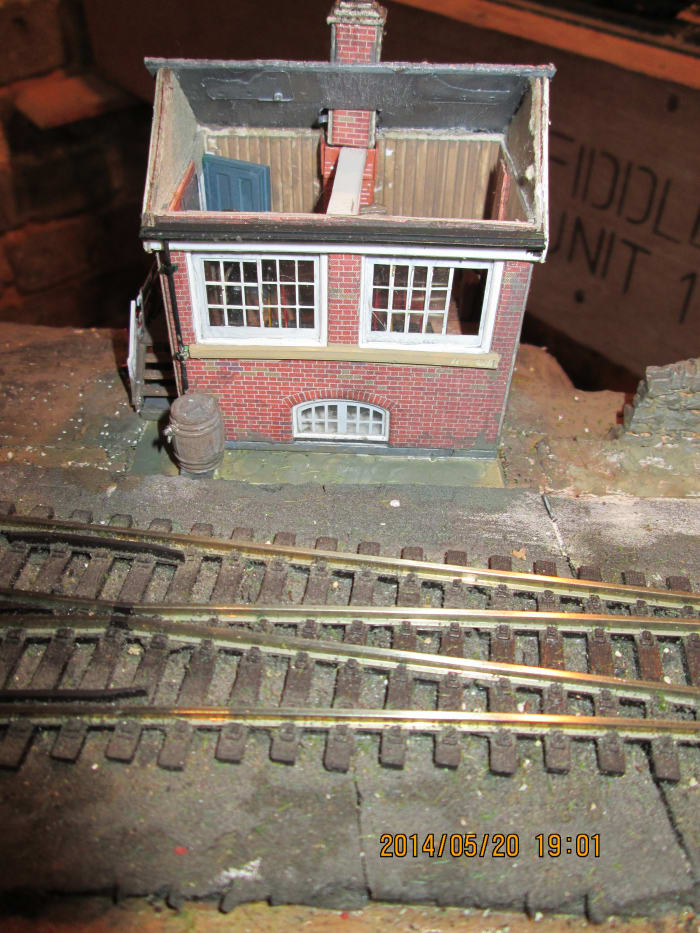 What started out as a Metcalfe card kit (free with Hornby Magazine) became a hybrid with elements from a Ratio signal box kit, D&H NER window etchings, Evergreen siding painted to look like wood planking on floor and walls and Wills slate roof
