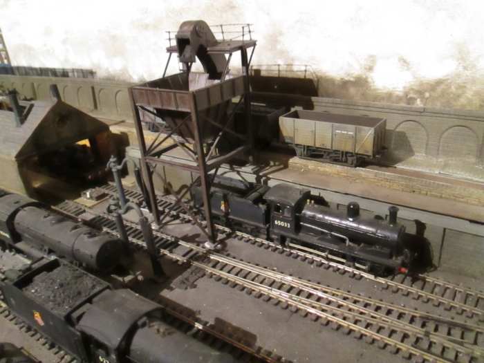 Looking the other way, with a Class J21 awaiting its turn under the post-WWII coaler - beyond that is the open end of the decrepit, war-damaged loco shed. An ash pit has since been added on the middle road (Peco Inspection Pit)