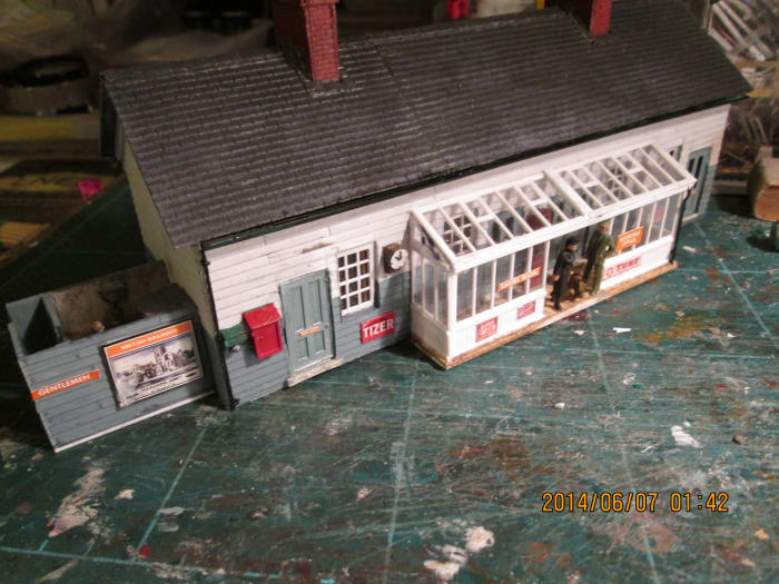 The station building, gents at the end. At left is staff/porters room, ladies' room, booking office and general waiting room far right