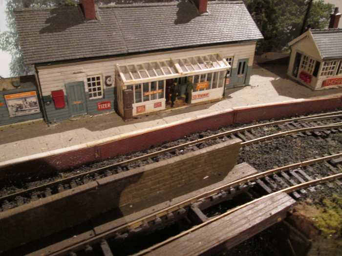 That timber station building you saw above in situ, scratchbuilt with Wills' timber walls, chimney stacks, slate roof, 2 x greenhouse kits for portico, Peco windows, doors, slot machine and wall box (staff phone)