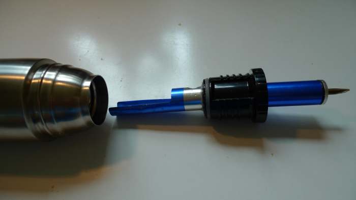 This is how the improved version looks like. The condenser is made from a desoldering pump. This design encourages the circulation of cold water into the condenser.