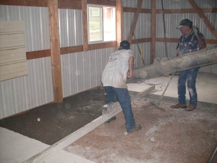 We had covered the window nearest the chute with a piece of sheet metal, in case of accidents in handling the chute or other equipment. That is a power screed lying across the section.