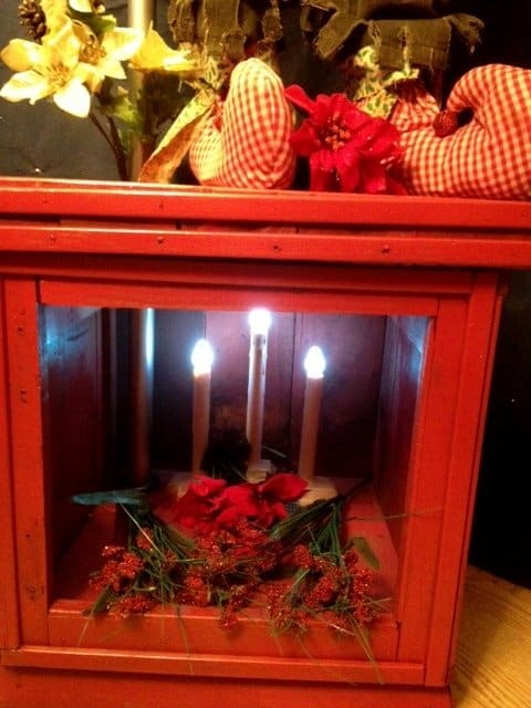 This shows the base of the elf mannequin lamp. This was a vintage end table that I repurposed and wired with a bottom light.