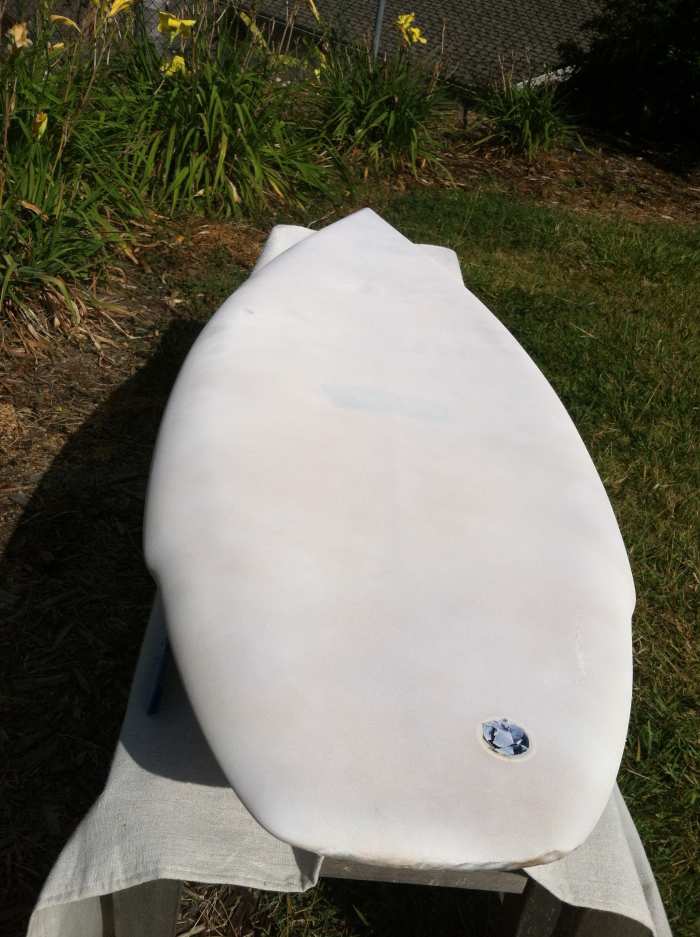 Primed board. I used two full cans of primer to cover front and back of the board. After a couple days, the stains started showing through at certain places.