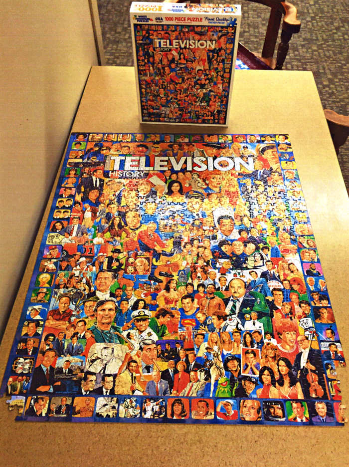 Beautiful Television Puzzle 1000 Pieces, and almost finished. Made by White Mountain, and the theme is: Television History.