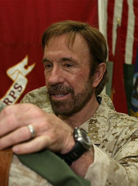 Chuck Norris signs a T-shirt for Corporal William P. Kessler, 23 of Cedar Park, Texas. Chuck Norris was one among many who toured Iraq, uplifting the hearts of our honored Americans in the service.