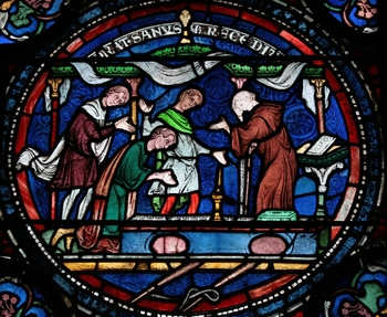 Thomas Beckett, an Archbishop of Canterbury created numerous, gorgeous stained glass windows in the cathedral. He is venerated as a saint and martyr. He was assassinated by followers of the King of England.