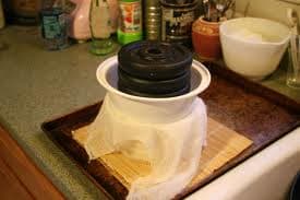This homemade cheesse press and mold work just fine. The important thing is proper even pressure and correct timing