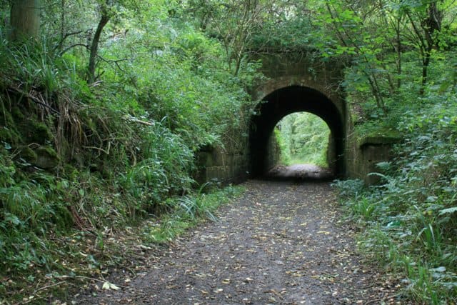 The tramway - now footpath - leads beyond the old carter's bridge past the remains of Quarry Siding and Guibal Fan house, aka 'SS Castle' above Wilton village to the Guisborough-Wilton road